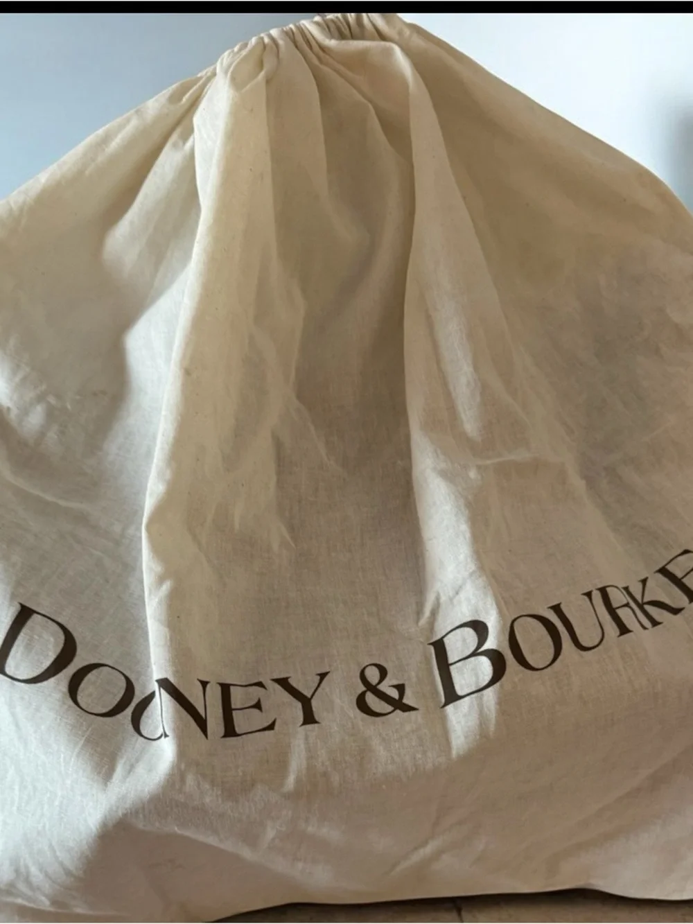Dooney & Bourke Brown Monogram Drawstring Bucket Bag with Tan Trim